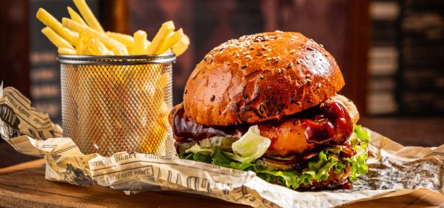 tasty burger with french fries and beer